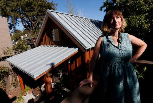 Karen Chapple is photographed on her deck overlooking her accessory dwelling unit at her home in Berkeley, Calif., on Tuesday, July 12, 2016. A series of new laws aim to make it easier for homeowners to build such units by avoiding separate utility metering and other previous restrictions. (Jane Tyska/Bay Area News Group)