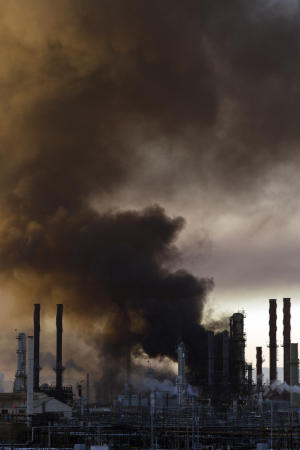 Smoke billows from a crude oil unit at the Chevron refinery in Richmond, Calif., on Monday, Aug. 6, 2012.
