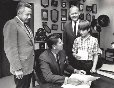 Gov. Ronald Reagan signs the California Environmental Quality Act in 1970 with Assemblyman John T. Knox, D-Richmond, second from right, and son John H. Knox. At left is Knox's friend, Republican Senator Bob Beverly. (Courtesy of John H. Knox)