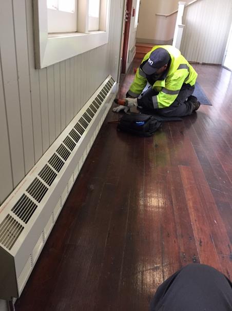 HVAC Will Santana installing baseboard heater in Plunge lobby (2)