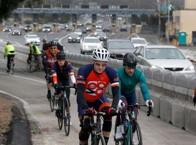 Bicyclists begin their inaugural ride.