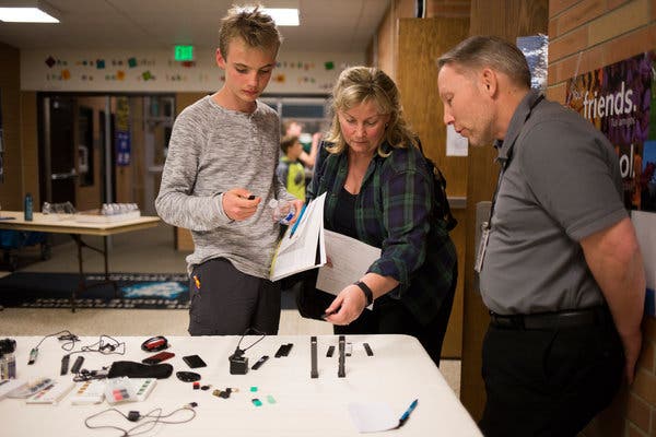 A presentation of various vape devices that were confiscated from students at a school in Boulder, Colo., in March. In January, the Colorado school system had received an offer from a former educator working with Juul to develop an anti-vaping curriculum.