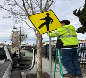 Ped crossing sign reinstalled at Mcdonald ave. and 43rd st.