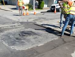Forde installing new manhole on Macdonald