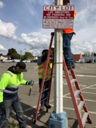 Street Sweeping Sings installed at City Hall Parking lots