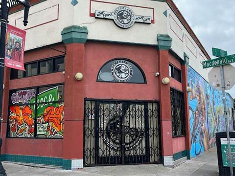 the red front of the closed down rich city rides bike shop