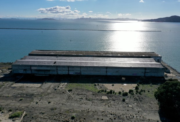 A former industrial plot of land is seen from this drone view along Brickyard Cove Road near Dorman Drive in Richmond, Calif., on Monday, Dec. 12, 2022. The proposed Terminal One project of 154 single-family homes over 13.8 acres of prime waterfront real estate is going back to the drawing board. (Jane Tyska/Bay Area News Group)